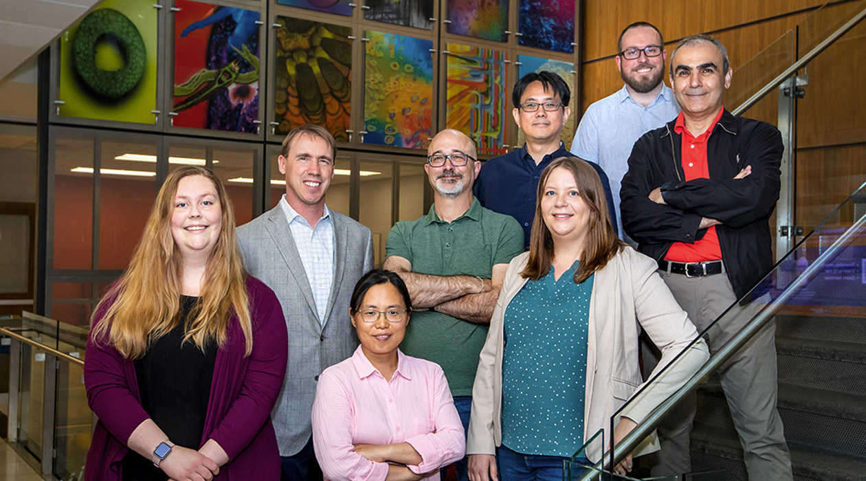 The study team included, back row, from left, graduate student Rebecca Ultrich; chemistry professor Paul Hergenrother; Chris Fields, of the Roy J. Carver Biotechnology Center, research scientist Po-Chao Wen, graduate student Matt Sinclair; and, front row, from left, senior scientist Hyang Yeon Lee; Jessica Holmes, of the Roy J. Carver Biotechnology Center; and biochemistry professor Emad Tajkhorshid. (Study lead author Kristen Muñoz not pictured)