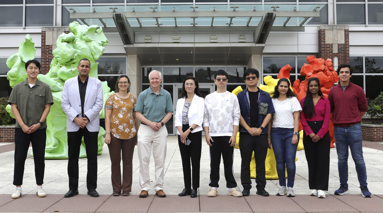 Brian Cunningham, Intel Alumni Endowed Chair of Electrical and Computer Engineering, and Ying Fang, professor of pathobiology in the College of Veterinary Medicine (center) and lab members to develop portable point-of-use biosensor for detection of African swine fever virus in farm environments. 